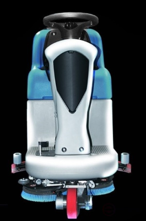 Battery-powered scrubbing machine with an operator