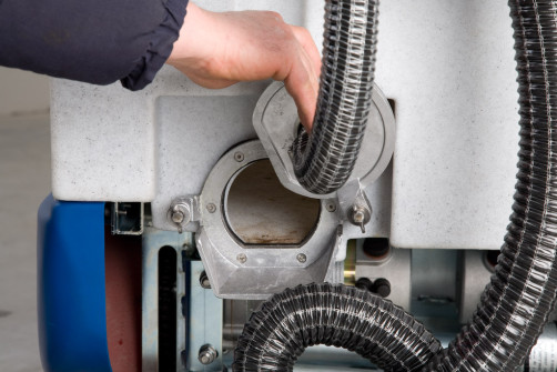 Battery cleaning machine with operator