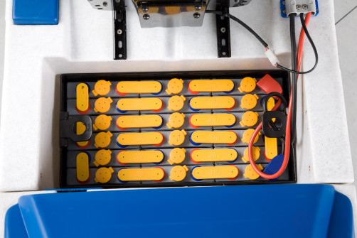 Battery cleaning machine with operator